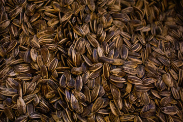 background image of multiple sunflower seeds on the shop for sale