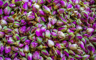 Background Dried rosebuds background texture closeup. violet rosebud macro close up of heap.