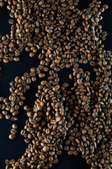 Fresh dark coffee beans close up