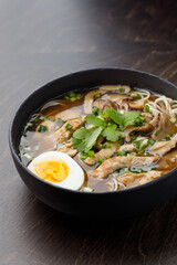 Noodle soup, egg and greens