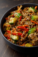 Noodles with vegetables and meat close up