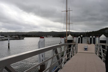 Obraz premium Empty space. An empty wharf in Australia. Gloomy sky, place looks like abandoned. 