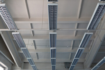 Fototapeta premium Industrial mercury lamps in rectangular lamps in an old building.