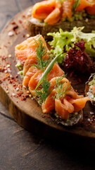 Fried bread with salmon with lettuce leaves