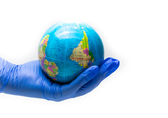 Hand with blue glove and hold a globe at the times global situation facing the coronavirus 2019 isolated on white background.