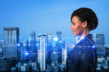 Attractive black businesswoman pondering on technology at business process to achieve tremendous...