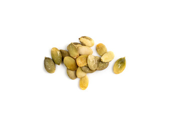 Pumpkin seeds pile isolated on white background top view