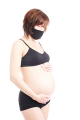 Pregnant caucasian woman in black sportswear and in protect mask isolated on white background.