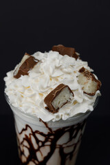 Milk shake with chocolate and hazelnuts close-up.