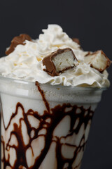 Milk shake with chocolate and hazelnuts close-up