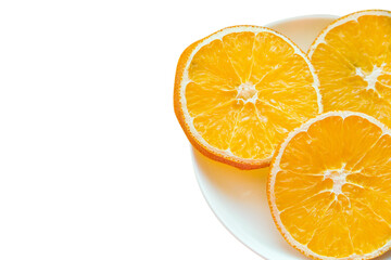 Plate with three slices of dried orange isolated on a white background with place for text. Copy space