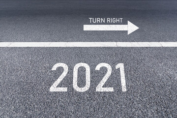 The sign arrow turns right to ahead 2021 Written on The asphalt road background The vision new year of 2021.