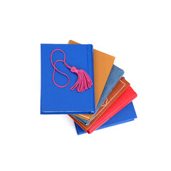 Stack of books in colour covers with white sheets isolated on a white background