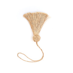 Golden silk tassel isolated on white background for creating graphic concepts