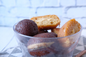 close up of indian sweet in a bowl on table.
