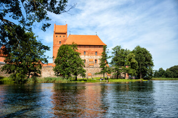 TRAKAI, LITHUANIA - JULY 29, 2017: Photo editor, A beautiful medieval castle surrounded by a lake close-up.