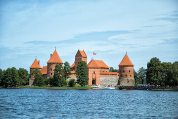 TRAKAI, LITHUANIA - JULY 29, 2017: Photo editor, A very beautiful medieval castle surrounded by a blue lake.