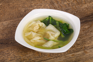 Asian traditional Wonton soup with herbs