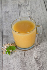 Dietary vegetarian oats milk over wooden