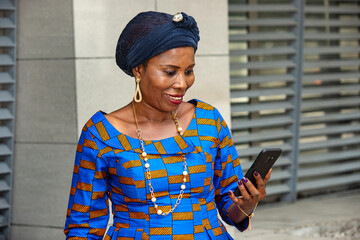 adult business woman reading message on her mobile phone.