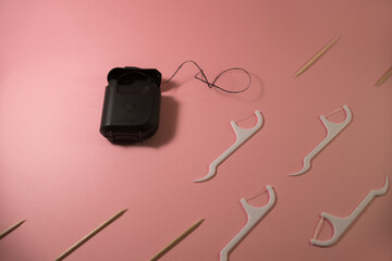 oral hygiene and dental floss with toothpicks
