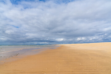 beautiful wide empty golden sand beach