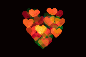 Colored heart-shaped lights on a black background