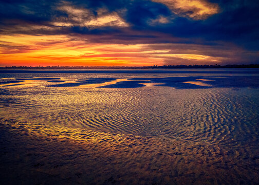 Sunsetting at low tide at Matanzas Inlet in St. Augustine, Florida.