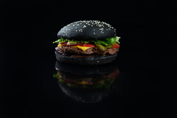 Perfect hamburger classic burger American cheeseburger with cheese, bacon, tomato and lettuce.