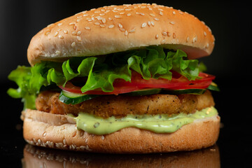 The perfect burger classic burger American burger with chicken, lettuce, tomato and sauce.