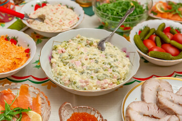 Delicious food and snacks on a festive served table on New Year's and Christmas Eve