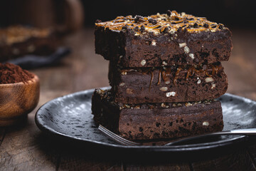 Dark Chocolate Brownies Stacked on a Plate