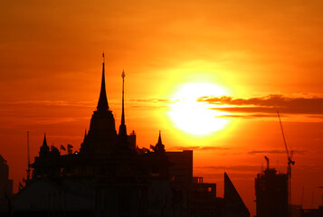 Silhouette of the Chedi Phu Khao Thong (Golden Mount) of Wat Saket Temple at Dawn, the Iconic Landmark of Bangkok, Thailand