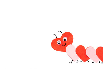 Funny paper caterpillar of red and pink paper hearts on a white background.Handmade greeting card for Valentine's Day and Mother's Day.Copy space for text.
