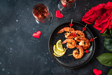  Fried shrimp, roses and champagne. Original appetizer for Valentine's Day, romantic dinner. Top view, free space for text