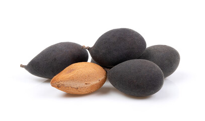 velvet tamarind fruit ( Dialium cochinchinense) isolated on white