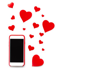 Mobile phone with red hearts like likes on a white background. Horizontal orientation, copy space.
