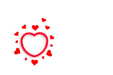 Red hearts on a white background. Valentine's Day. Horizontal orientation, copy space, top view.