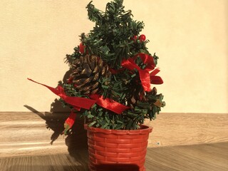 Fototapeta premium christmas tree with red ribbon