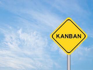 Yellow transportation sign with word kanban on blue sky background