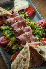 sandwich with ham and vegetables
salad with beef and vegetables