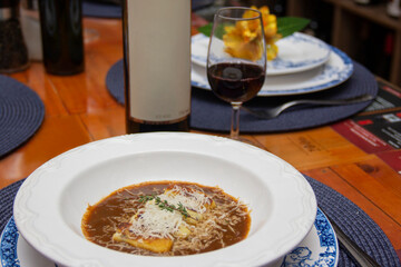 Gnocchi stuffed with ossobuco, ossobuco broth and grana padano cheese