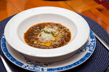 Gnocchi stuffed with ossobuco, ossobuco broth and grana padano cheese