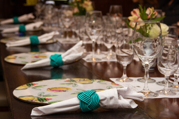 Dining table with bowls and dishes set for dinner and wine tasting.