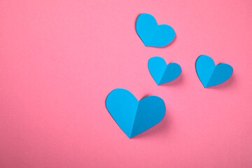 Fototapeta na wymiar Blue hearts, symbolizing a boy or a man. Falling in love and relationships concep