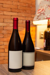 Bottles of red wine on wooden table. Decoration