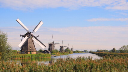 windmills at the undesco world heritage site of kinderdijk in rotterdam, the netherlands - obrazy, fototapety, plakaty