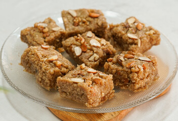 famous pakistani halwa sweet Pieces of sohan halwa in a plate