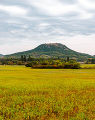 View of the Csobánchegy (hill of Csobánc) with dramatic sky close to Tapolca.