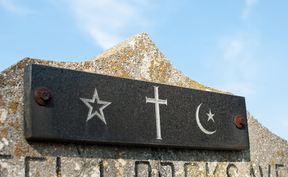 Star of David, Cross  and Islamic Crescenton on the marble tombstones
